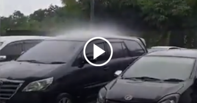 Video: Kỳ lạ cơn mưa chỉ trút nước xối xả vào một chiếc ô tô trong bãi đậu xe