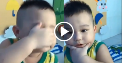 Bé trai nhanh chóng lau nước mắt khi biết mình được chụp hình