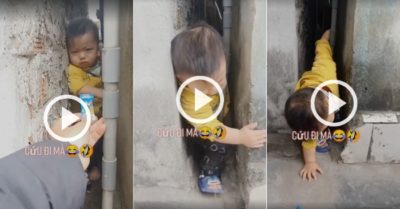 Video: Mẹ dùng kẹo bình tĩnh dụ con thoát khỏi khe tường hẹp