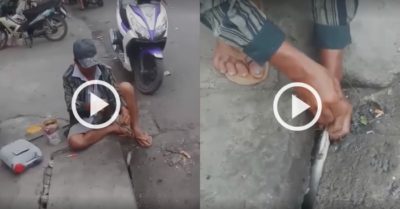 Video: Người đàn ông câu cá dưới nắp cống ở Sài Gòn