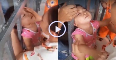 Video: Gay cấn màn giải cứu bé gái kẹt đầu vào song sắt