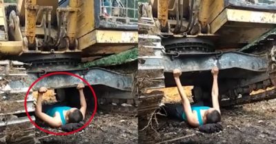 Video: Người đàn ông đẩy tạ bằng máy xúc